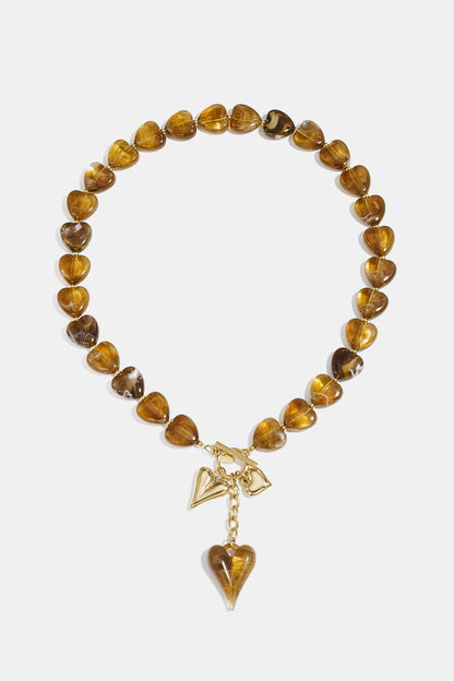 Bead necklace with hanging heart charms