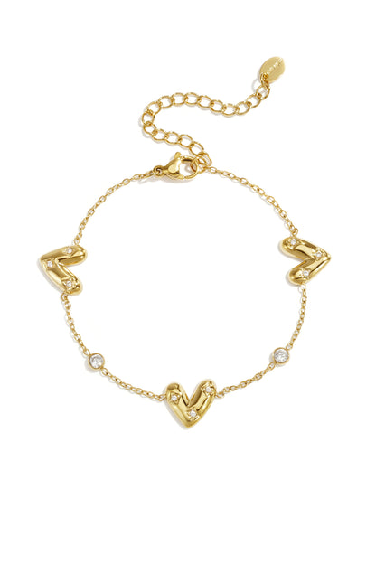 Armband mit drei herzförmigen Elementen und runden Zirkonia-Steinen