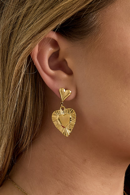 Earrings with heart-shaped pendants