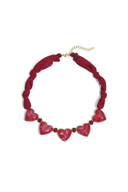 Fabric necklace with heart beads
